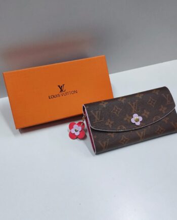 Loiu Emilie Wallet in the Monogram Canvas with pink accents and a Monogram Flower detail.
