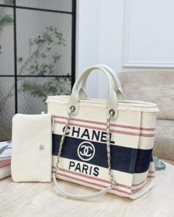CC Deauville Tote Bag in a combination of beige/off-white and navy blue, with red stripes as an accent.