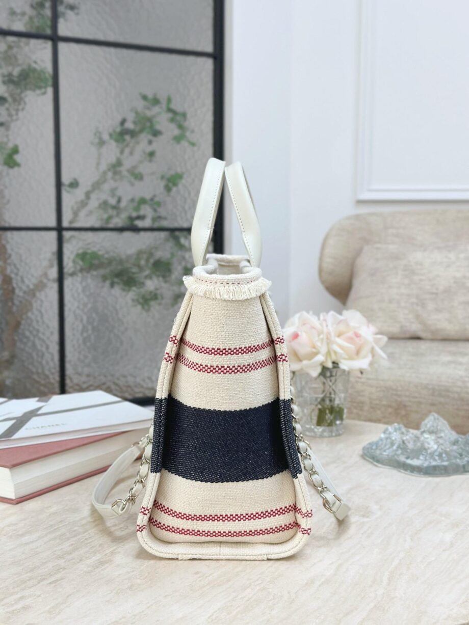 CC Deauville Tote Bag in a combination of beige/off-white and navy blue, with red stripes as an accent.