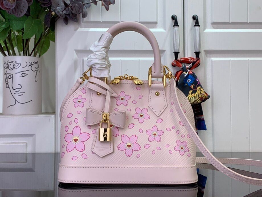 Loiu Alma BB bag in a light pink color, pink cherry blossom motifs.