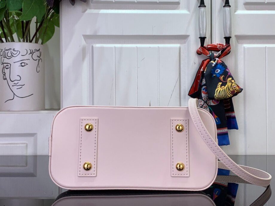 Loiu Alma BB bag in a light pink color, pink cherry blossom motifs.