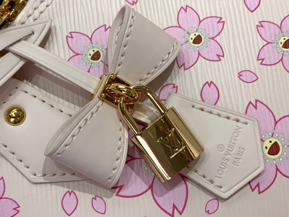 Loiu Alma BB bag in a light pink color, pink cherry blossom motifs.