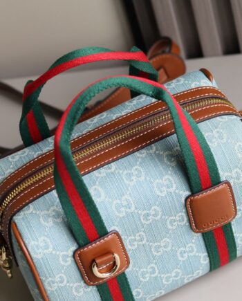 GG Mini duffle Handbag in light blue denim with web stripe in red and green.