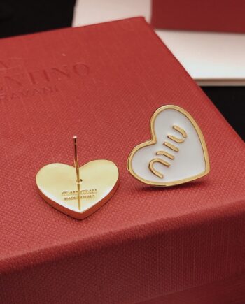 Mīū Mīū Logo Heart Earrings in White.